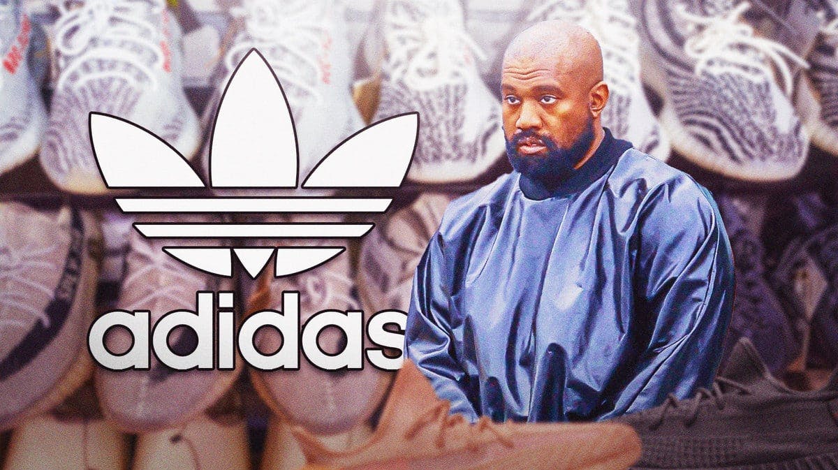 Kanye West and the Adidas logo in front of a display of Yeezy shoes