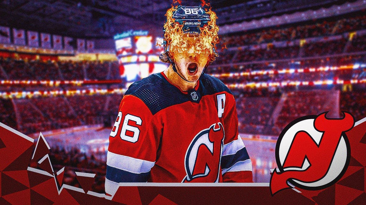 New Jersey Devils forward Jack Hughes with fire in his eyes in front of the team's home rink.