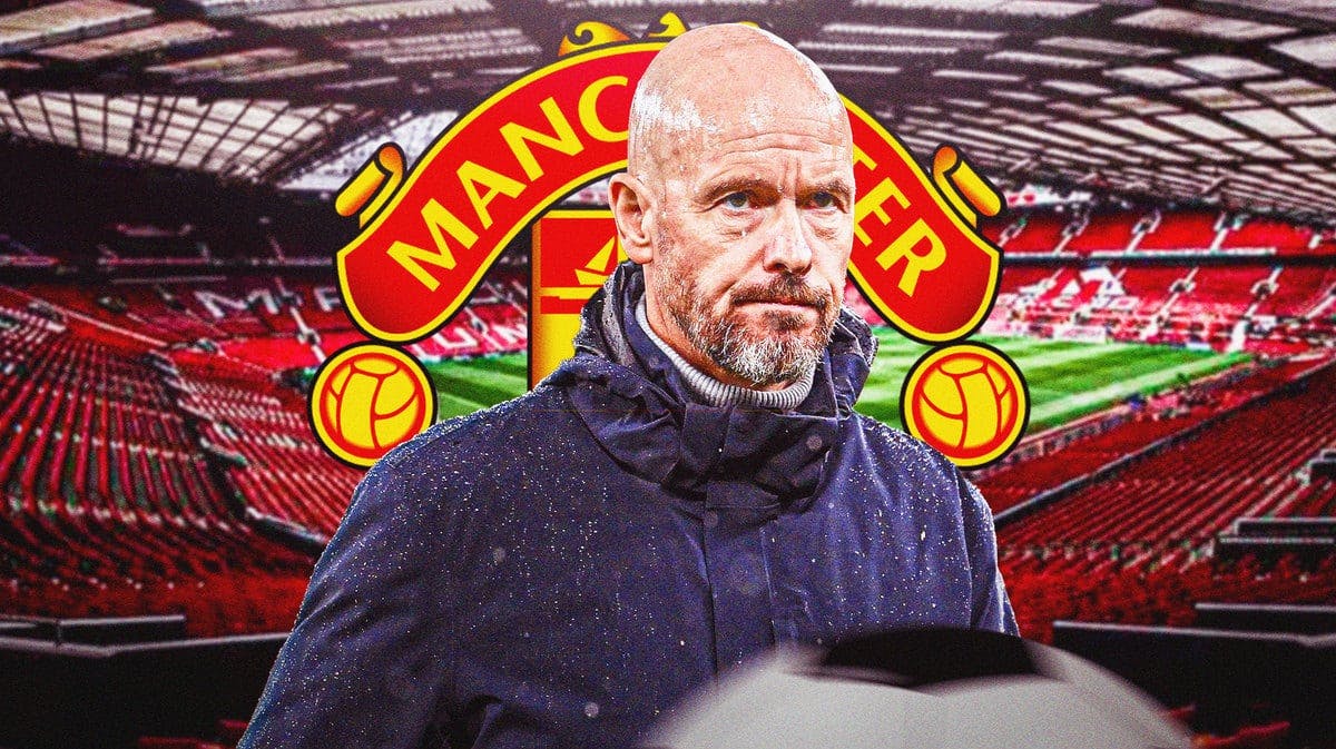 Erik ten Hag looking down/sad/worried in front of the Manchester United logo