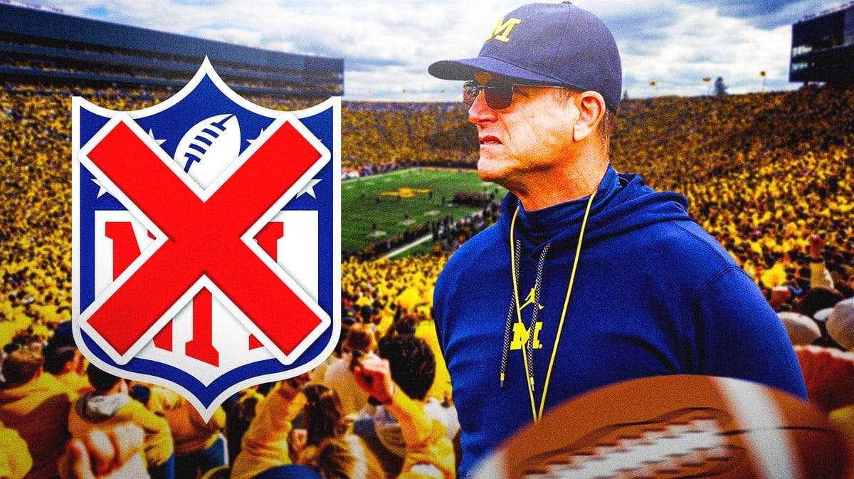 Michigan football coach Jim Harbaugh at Michigan stadium next to a crossed-out NFL logo