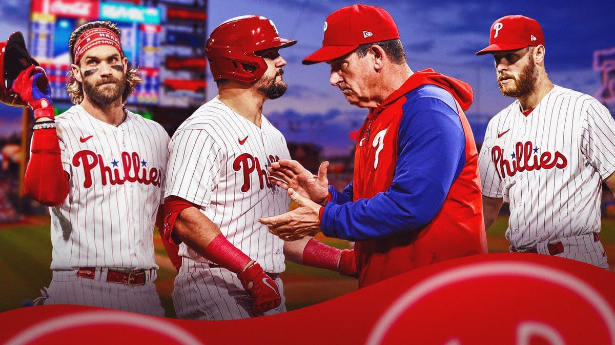 Phillies' Rob Thomson clapping, with Bryce Harper, Kyle Schwarber, and Zack Wheeler all disappointed