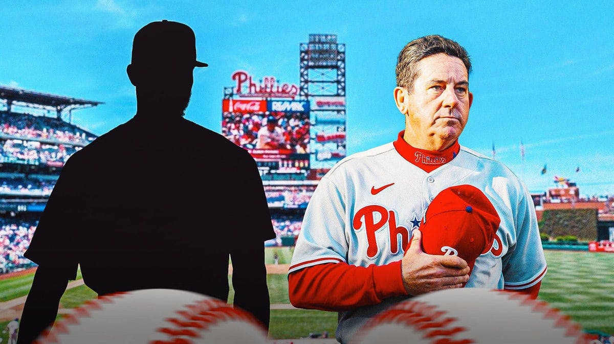 Silhouette of Philadelphia Phillies pitcher Cristopher Sanchez and Phillies manager Rob Thomson. Citizans Bank Park in the background.