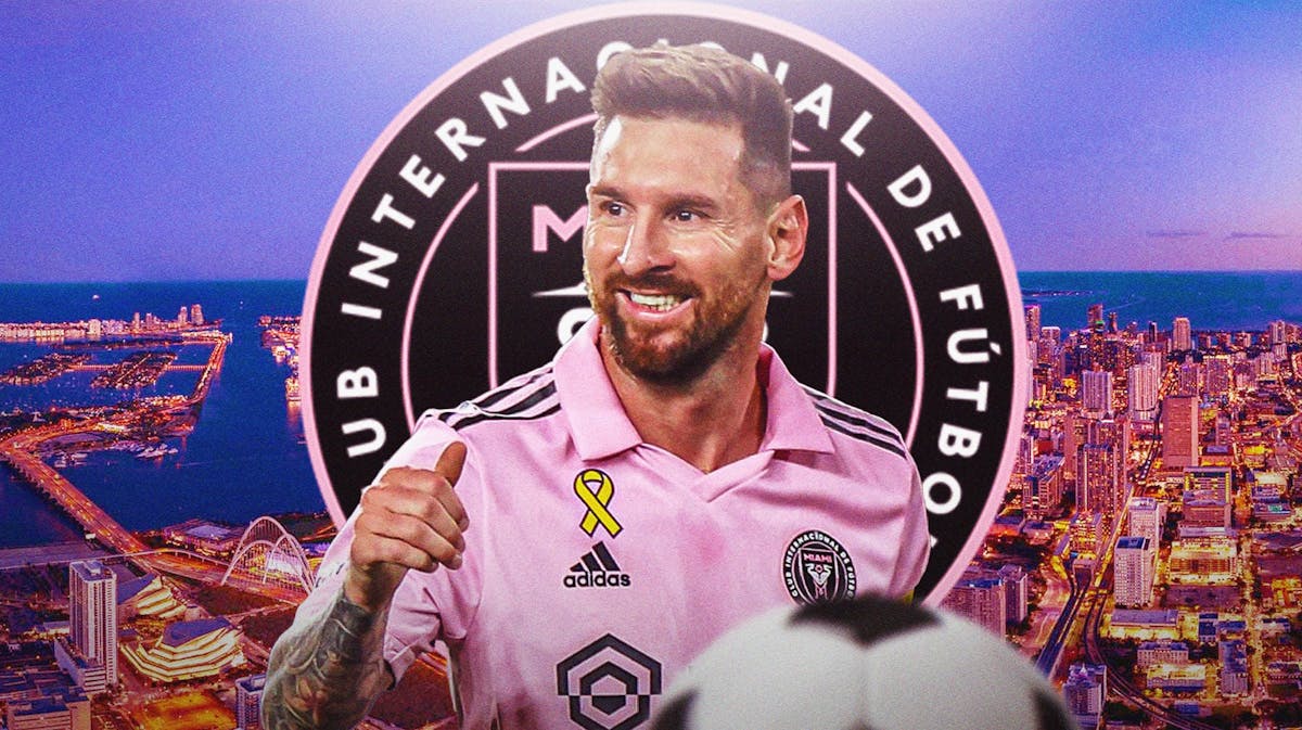 Lionel Messi smiling in front of the Inter Miami logo