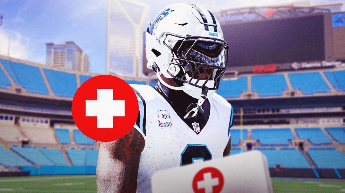 Brian Burns in a Carolina Panthers uniform with red + medical symbol indicating an injury