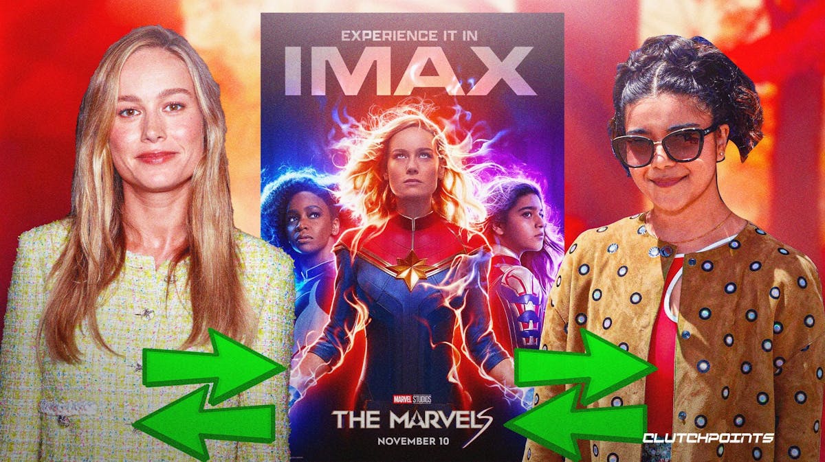 Brie Larson and Iman Vellani swapping places in front of The Marvels poster.