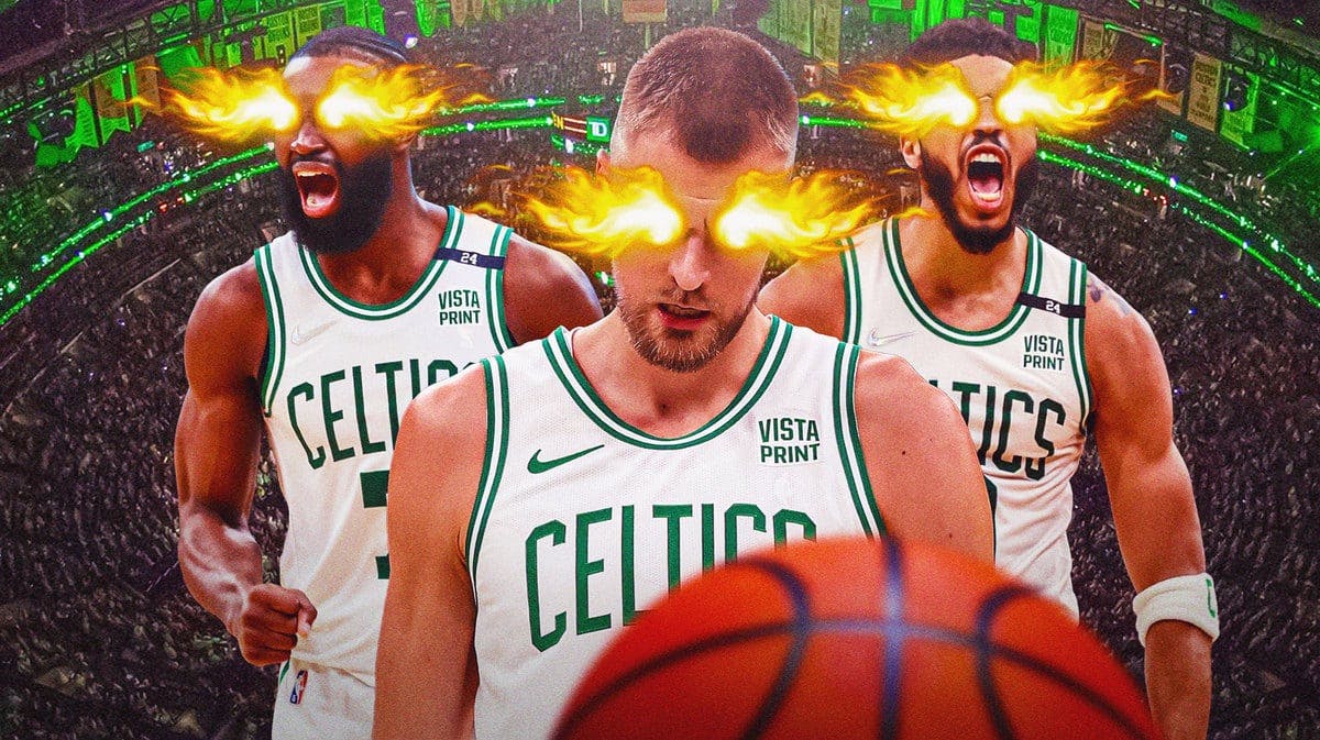 Celtics' Kristaps Porzingis in front with fire in eyes. Celtics' Jaylen Brown, Celtics' Jayson Tatum in background also with fire in eyes.