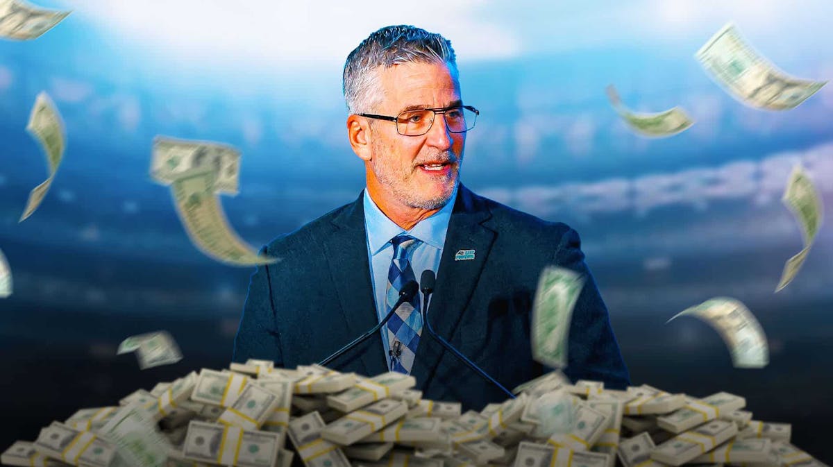 Frank Reich surrounded by piles of cash.