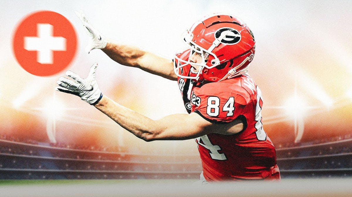 Ladd McConkey of Georgia football catching a ball but replace the ball with medical cross symbol