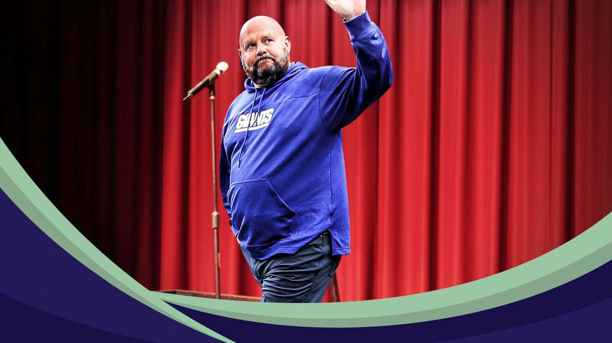 Photoshop image of GIants coach Brian Daboll to make it appear he is doing stand up comedy on a stage