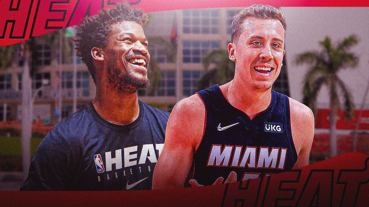 Miami Heat stars Jimmy Butler and Duncan Robinson in front of the Kaseya Center.