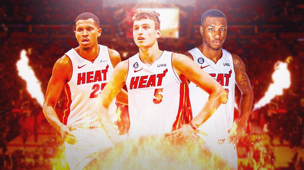 Miami Heat players Orlando Robinson, Nikola Jovic, and Jamal Cain in front of the Kaseya Center.