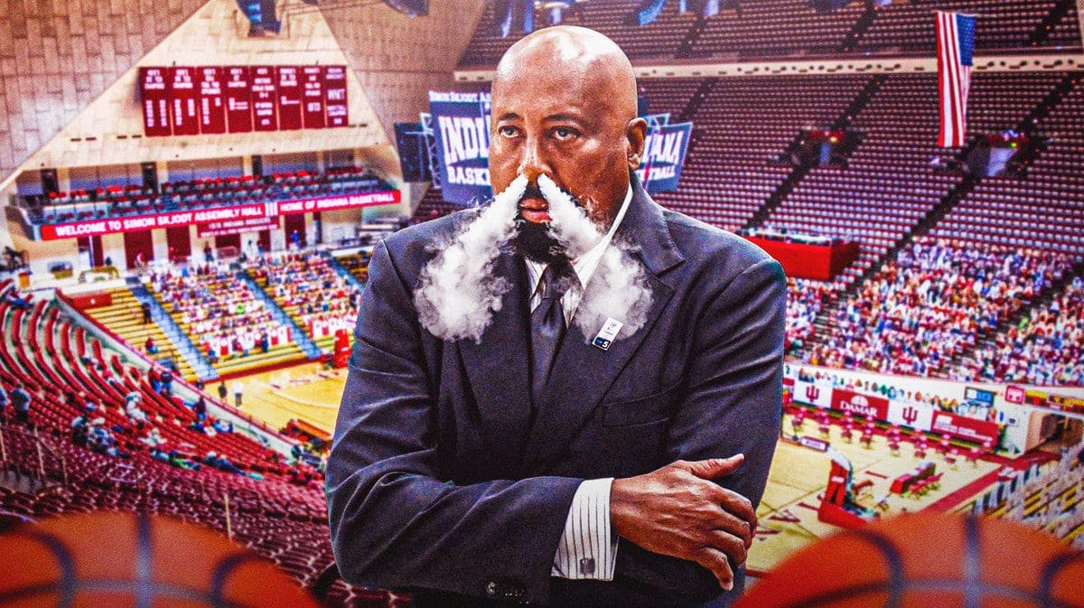 Indiana basketball head coach Mike Woodson looking serious and with smoke coming out his nose