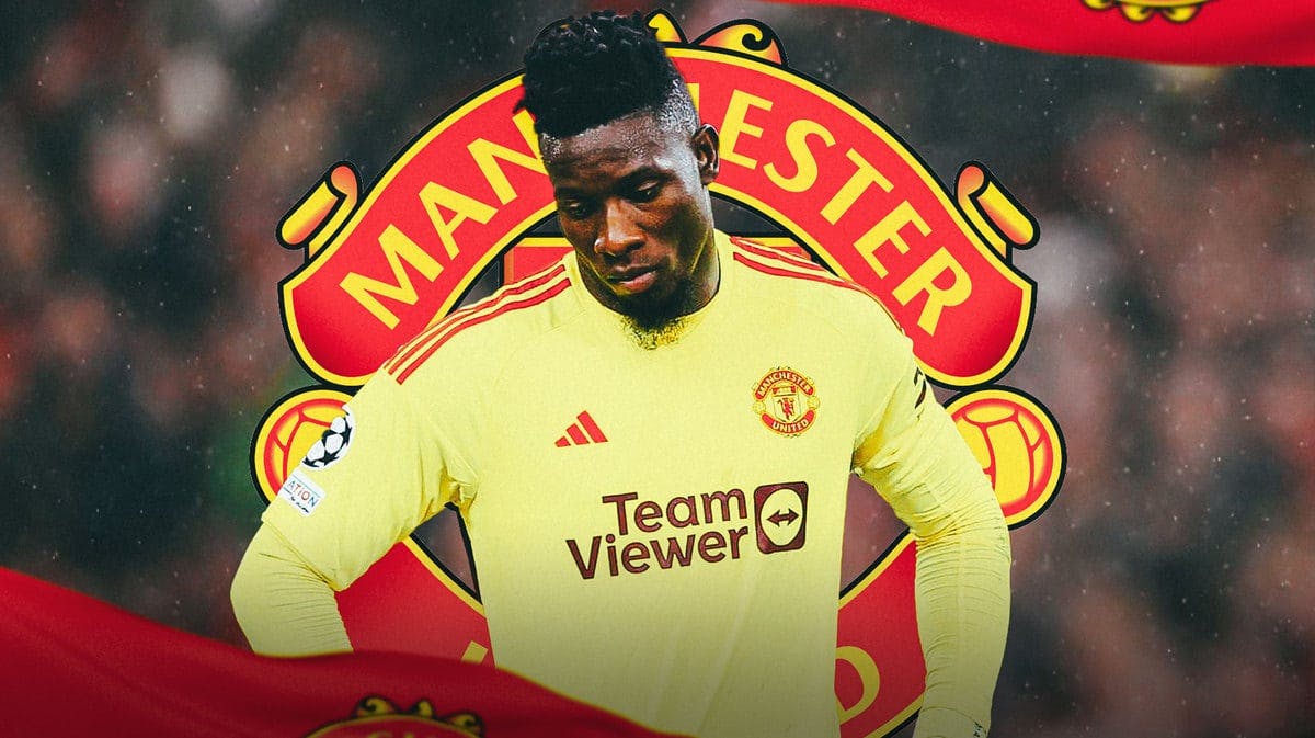 Andre Onana looking down/sad in front of the Manchester United logo