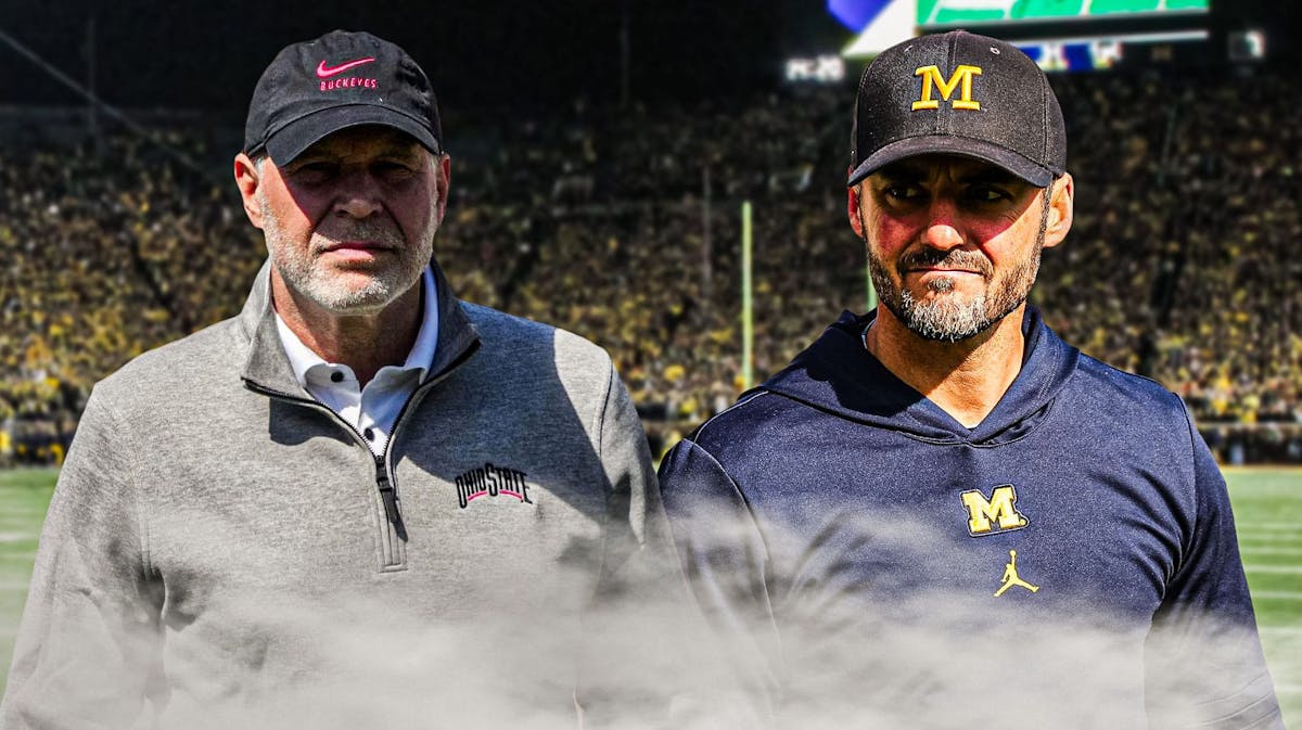 Michigan football, Wolverines, Ohio State football, Buckeyes, Jesse Minter, Jesse Minter (in Michigan gear) and Jim Knowles (in Ohio State gear) with Michigan football stadium in the background
