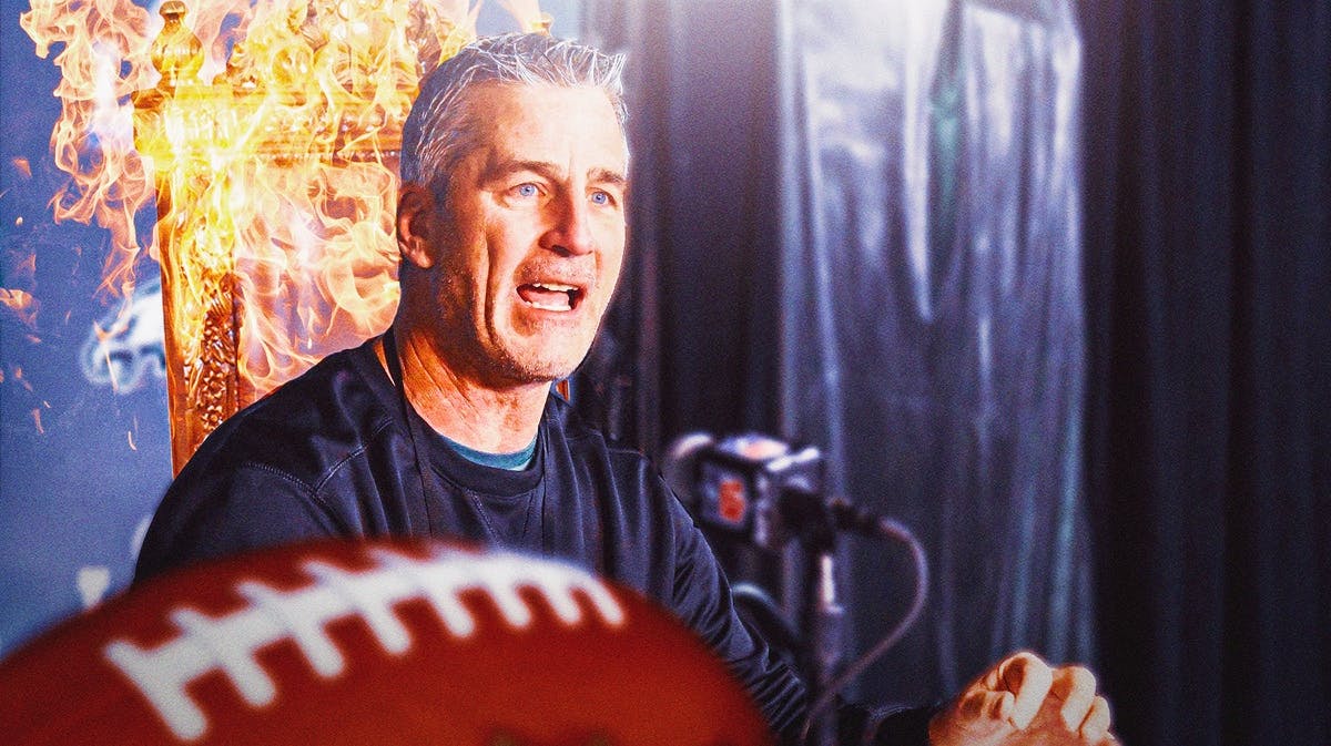 Frank Reich sitting on a chair that's on fire