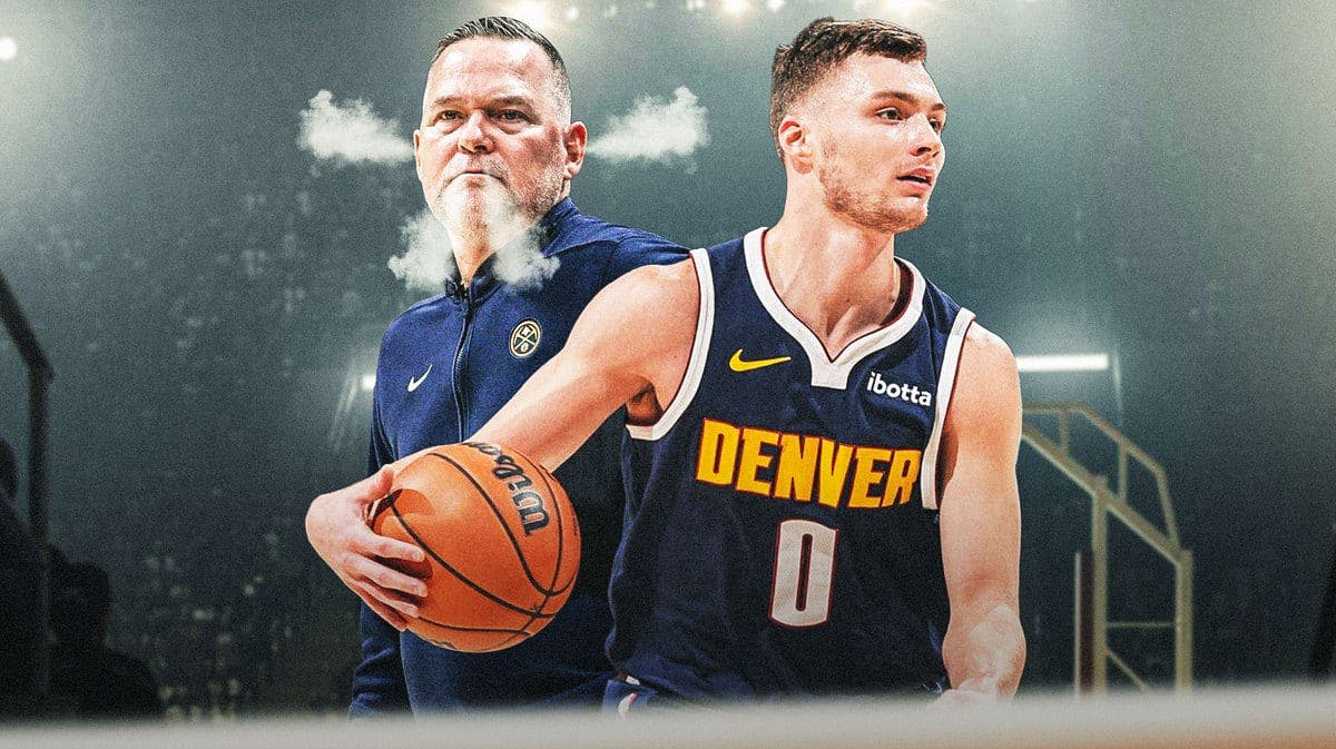 Michael Malone looking mad (lwith steam coming out of his nose. Christian Braun next to Malone
