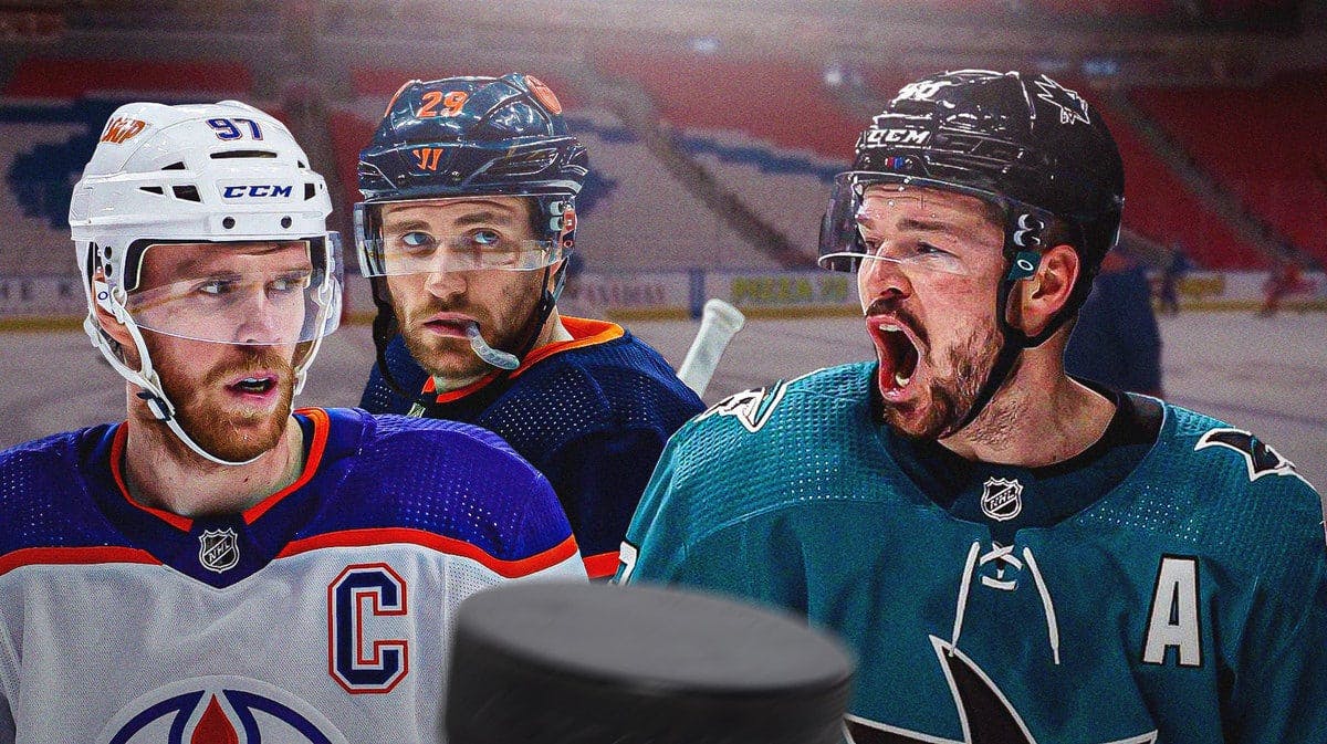 Oilers' Connor McDavid and Leon Draisaitl looking sad, with Sharks' Tomas Hertl looking hyped up