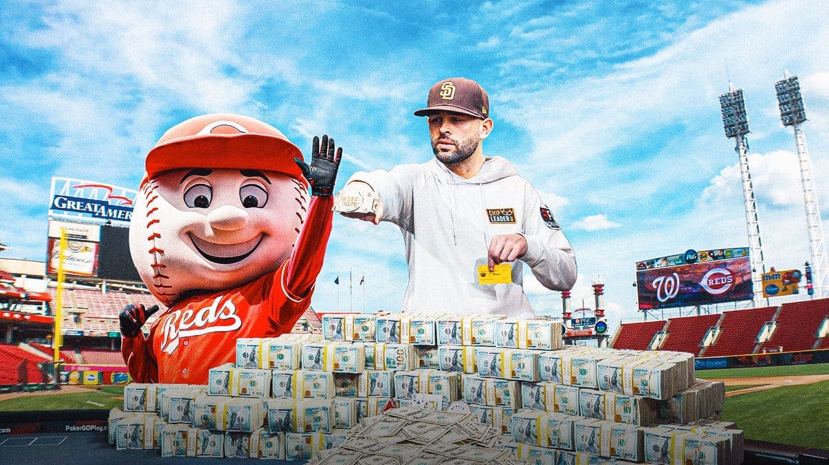 Action shot of Nick Martinez (Padres) with the Reds mascot and money