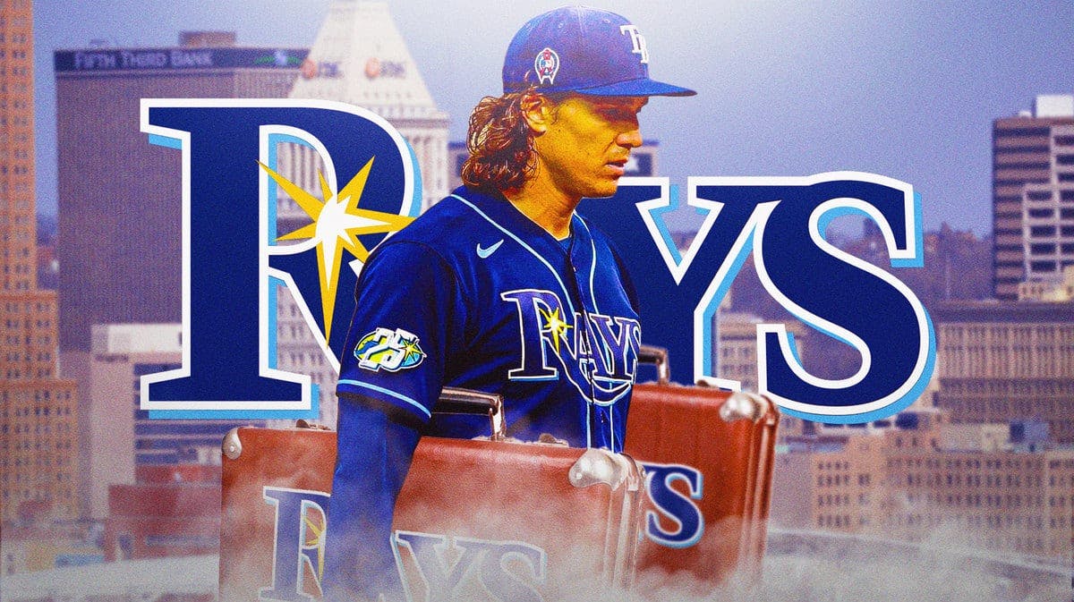 Rays' Tyler Glasnow holding two suitcases with the Rays logo in background.