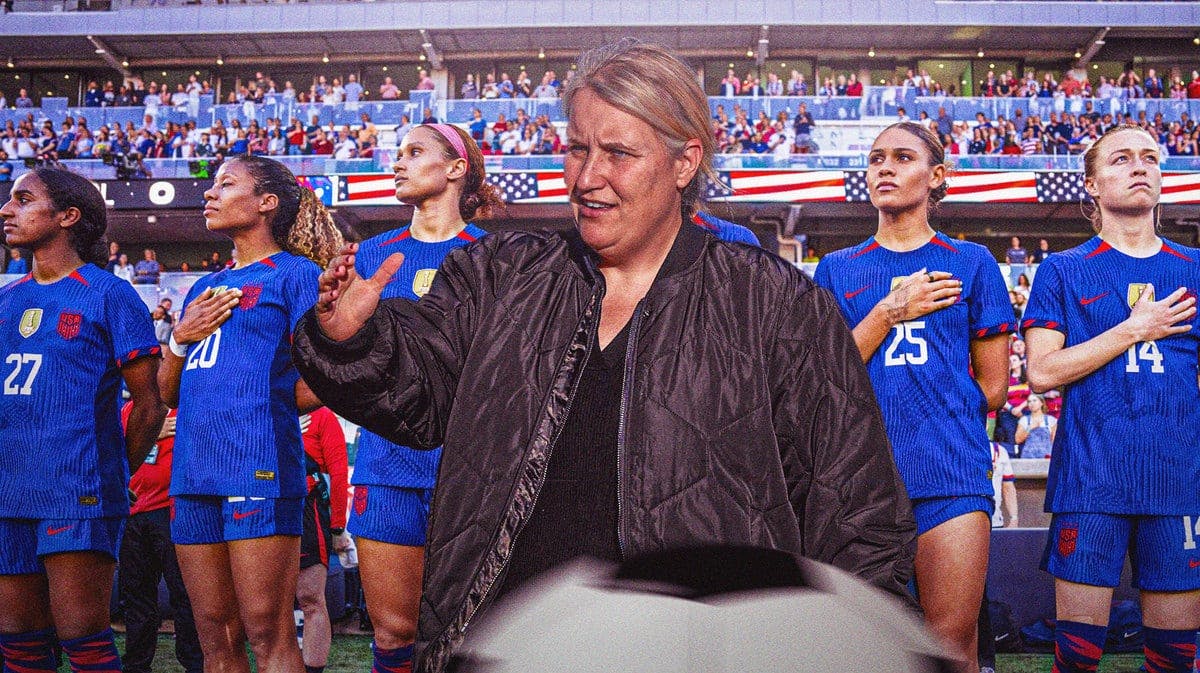Emma Hayes in the foreground, with the USWNT soccer team in the background behind Hayes
