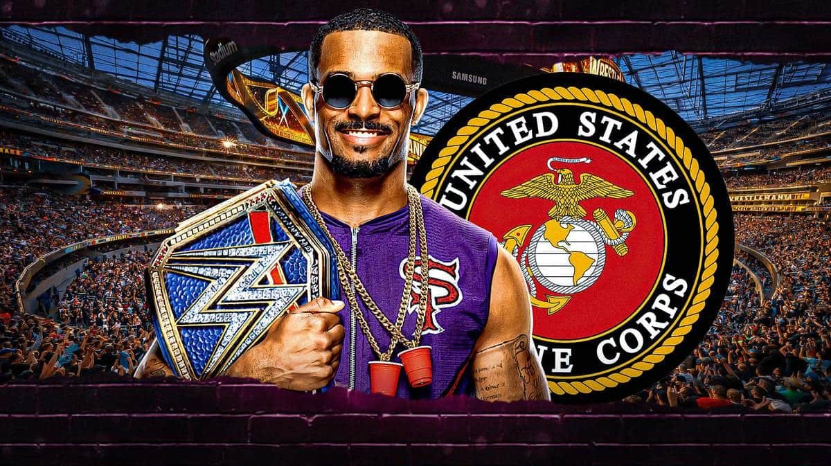 Montez Ford holding a WWE Championship belt with the US Marine Corps logo as the background.