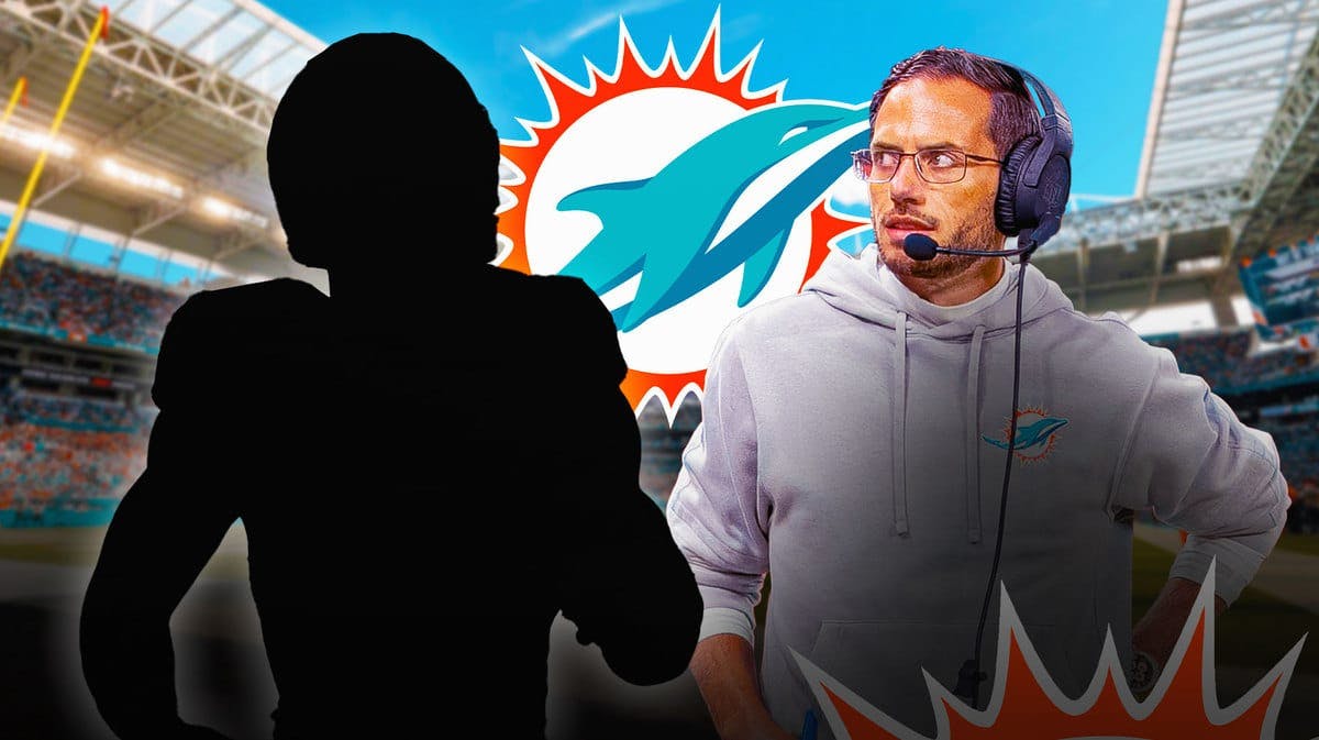 Silhouette of Kelvin Joseph and Dolphins head coach Mike McDaniel