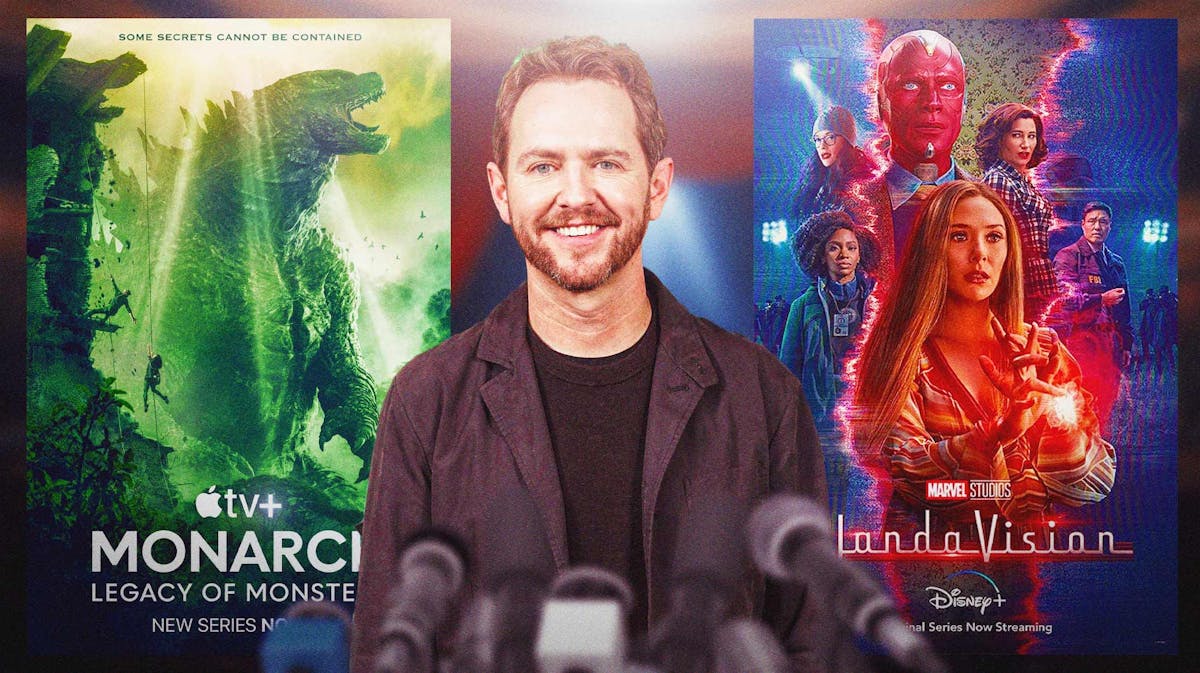 Matt Shakman between posters of Monarch: Legacy of Monsters and WandaVision.