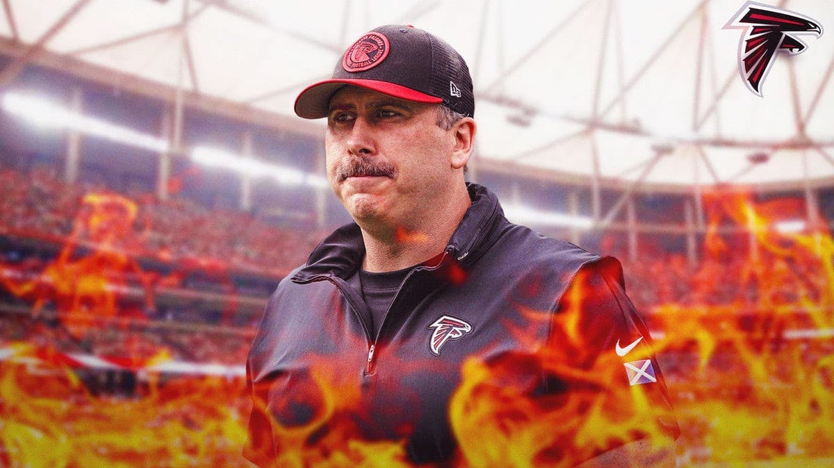 Falcons head coach Arthur Smith surrounded by flames