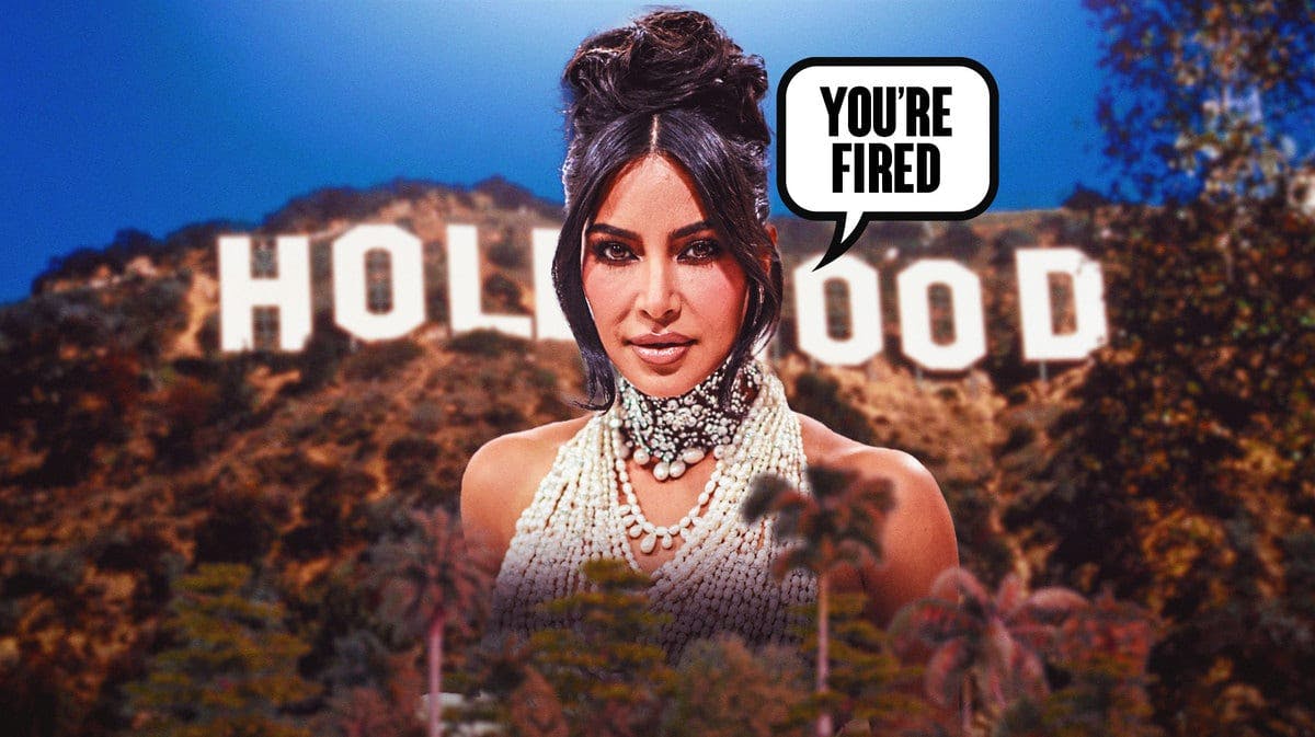 Kim Kardashian with a “You’re Fired" sign