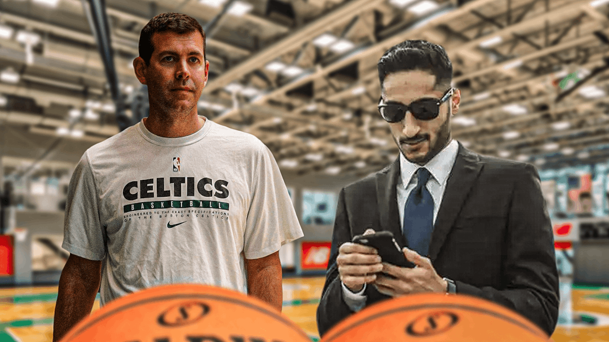 Brad Stevens looking stoic/serious next to shams charania (maybe this one of him on his phone image.png) with a celtics logo in the background