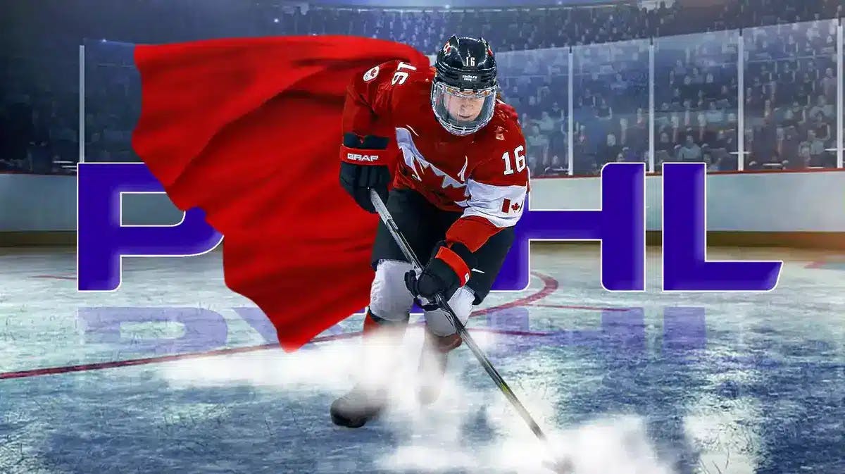 Jayna Hefford wearing a Superman/Superwoman cape standing in ice rink with PWHL logo in background