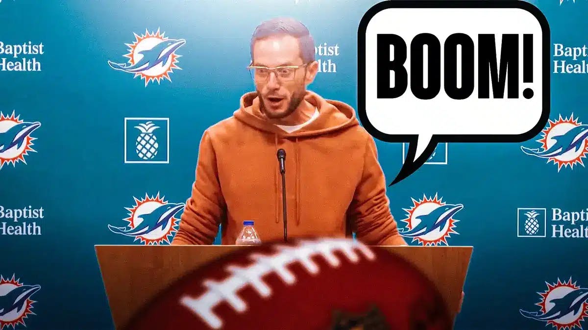Still of Mike McDaniels at the mic during a Dolphins press conference, with speech bubble “Boom!”