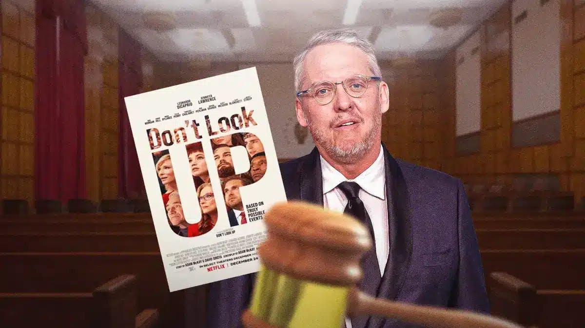 Adam McKay with the movie poster for Don't Look Up in a courtroom.