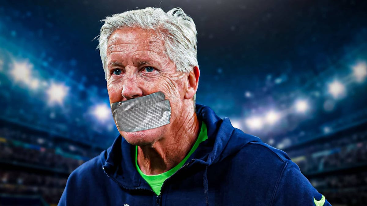 Seattle Seahawks coach Pete Carroll with tape over his mouth.