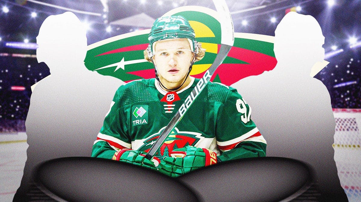 Kirill Kaprizov in middle of image, two silhouetted Minnesota Wild players (one on each side), MN Wild logo, hockey rink in background