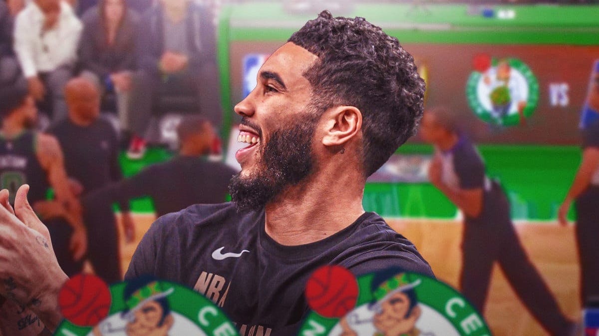 Jayson Tatum in front smiling