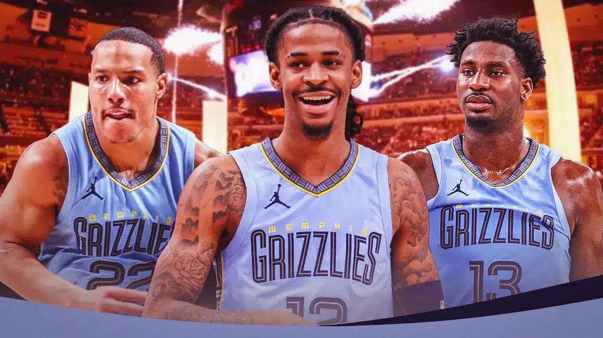 Memphis Grizzlies' Ja Morant smiling in front of Desmond Bane and Jaren Jackson Jr.