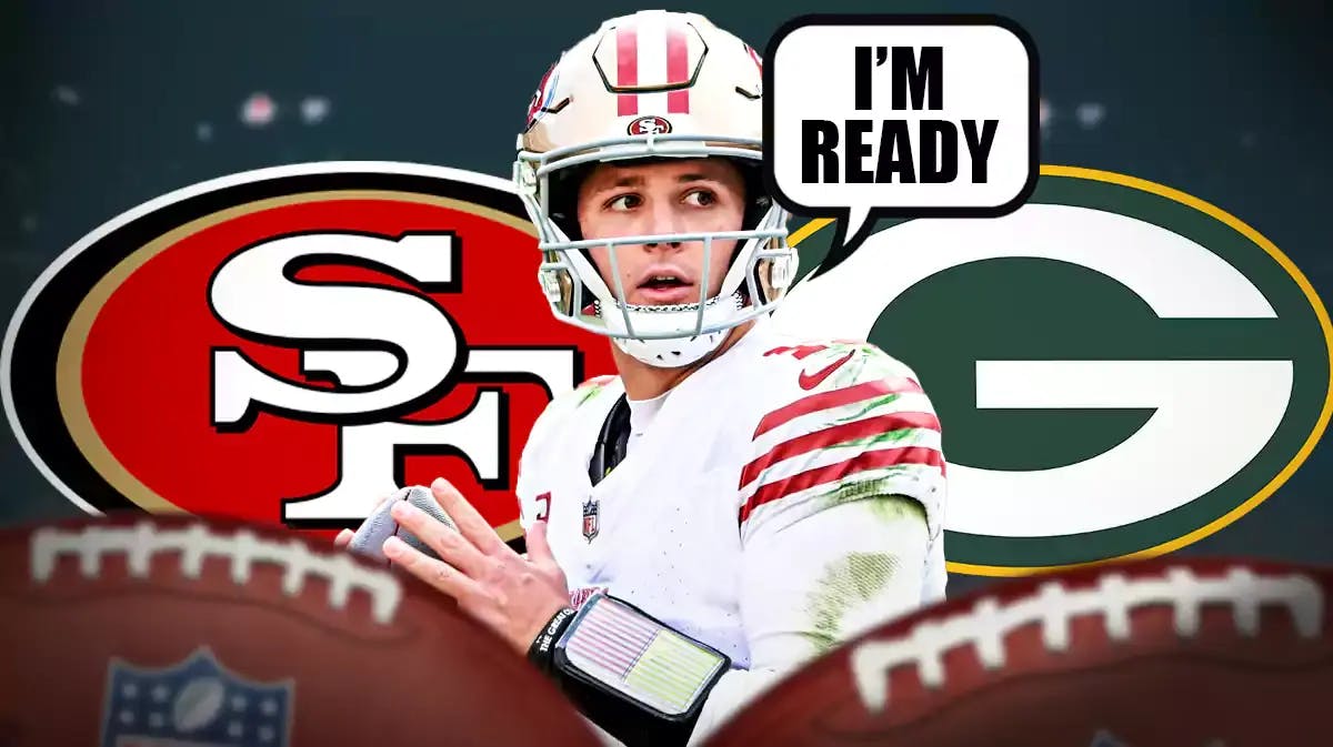 Brock Purdy in middle of image looking stern with speech bubble: “I’m ready” , 49ers and Packers logo on either side, football field in background