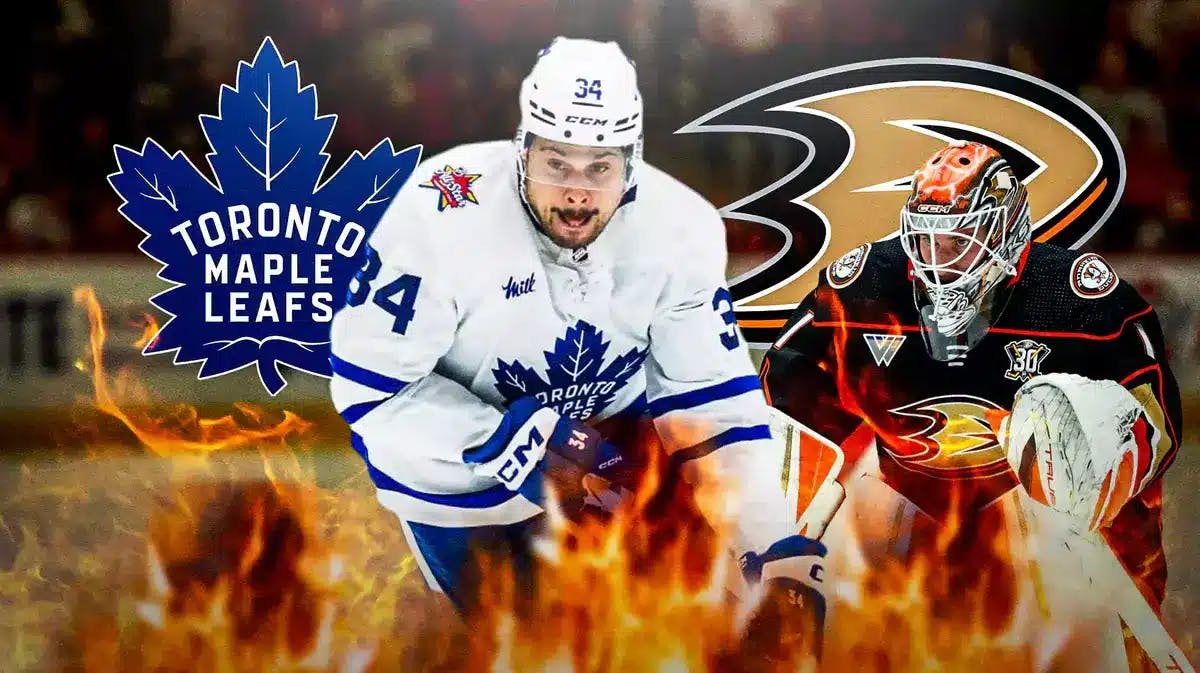 Auston Matthews in middle of image with fire around him, Lukas Dostal in image looking stern, TOR Maple Leafs and ANA Ducks logos, hockey rink in background
