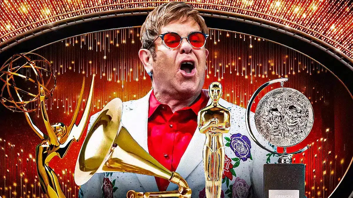 Elton John with EGOT trophies (Emmy Award, Grammy, Oscar Academy Award, and Tony Award).