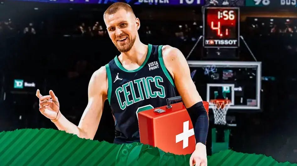 Celtics' Kristaps Porzingis carrying a medical kit