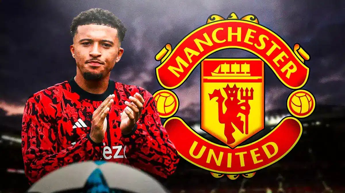 Jadon Sancho looking down/sad in front of the Manchester United logo