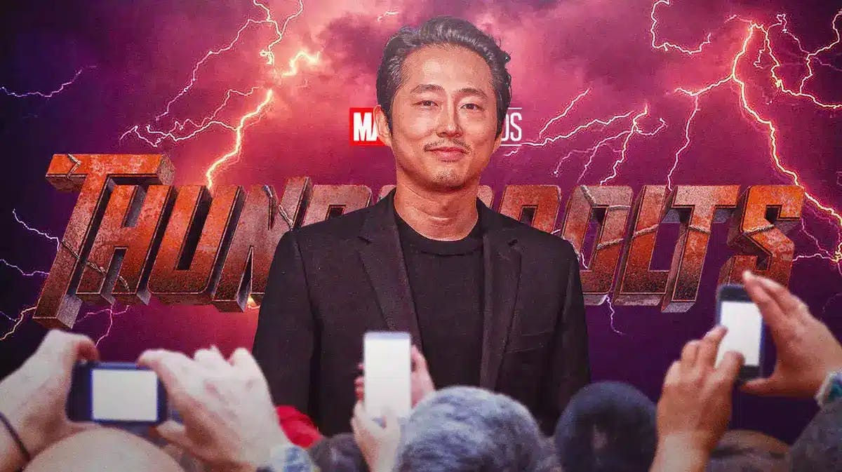 Steven Yeun in front of MCU Thunderbolts logo.