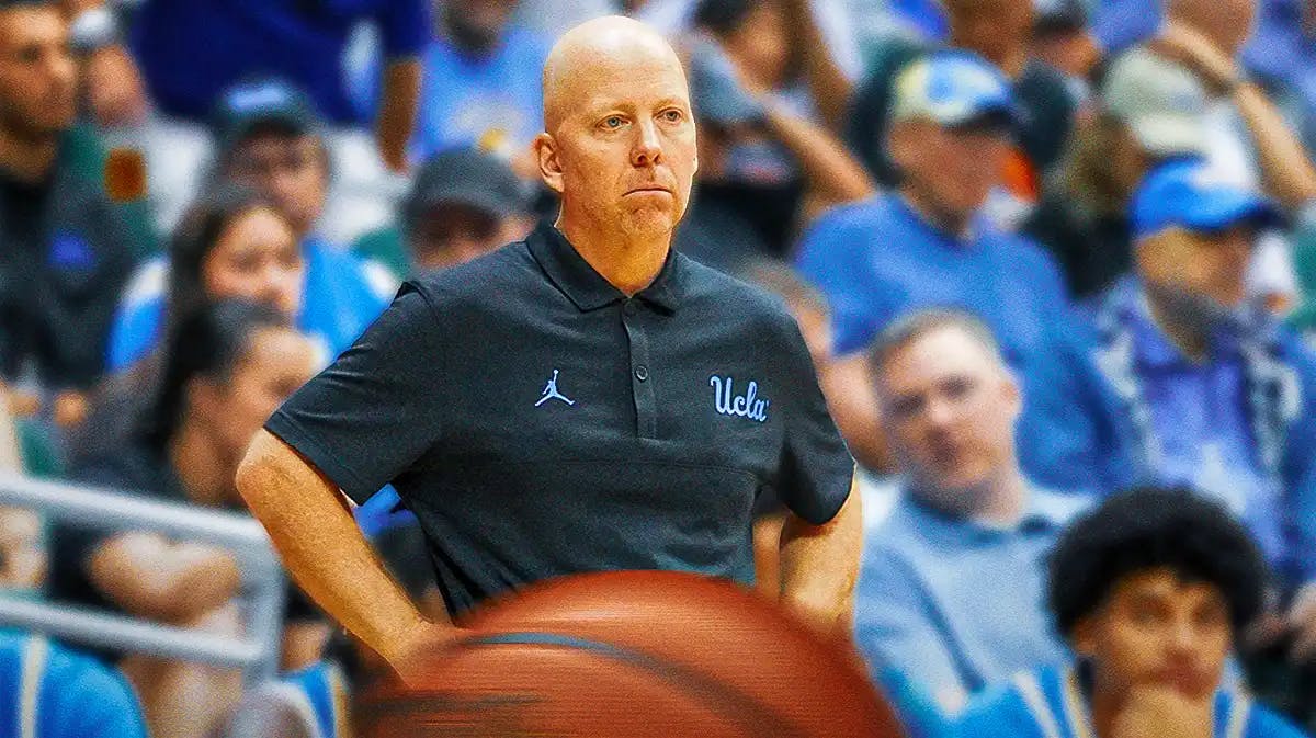 Mick Cronin with the UCLA arena the background