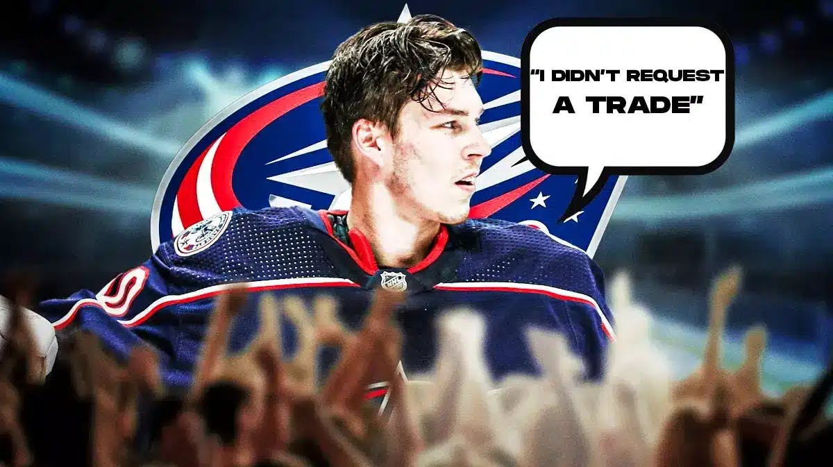 Elvis Merzlikins in middle of image looking stern with speech bubble: “I didn’t request a trade” , Columbus Blue Jackets logo, hockey rink in background