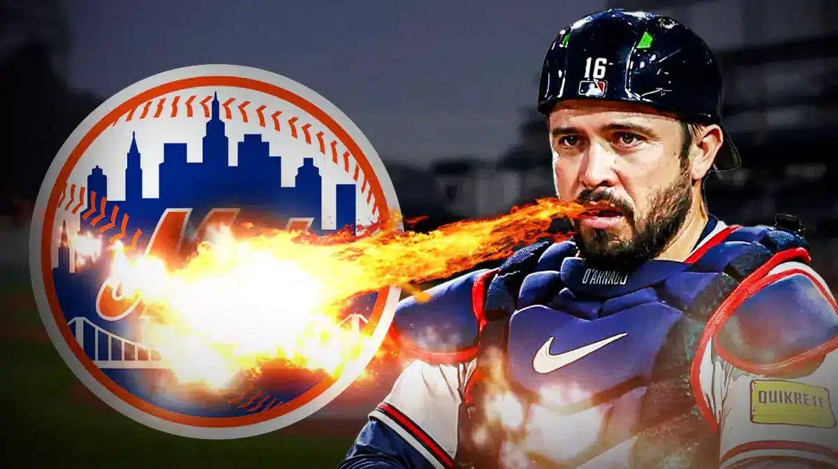 Braves' Travis d’Arnaud breathing fire at the New York Mets' logo.