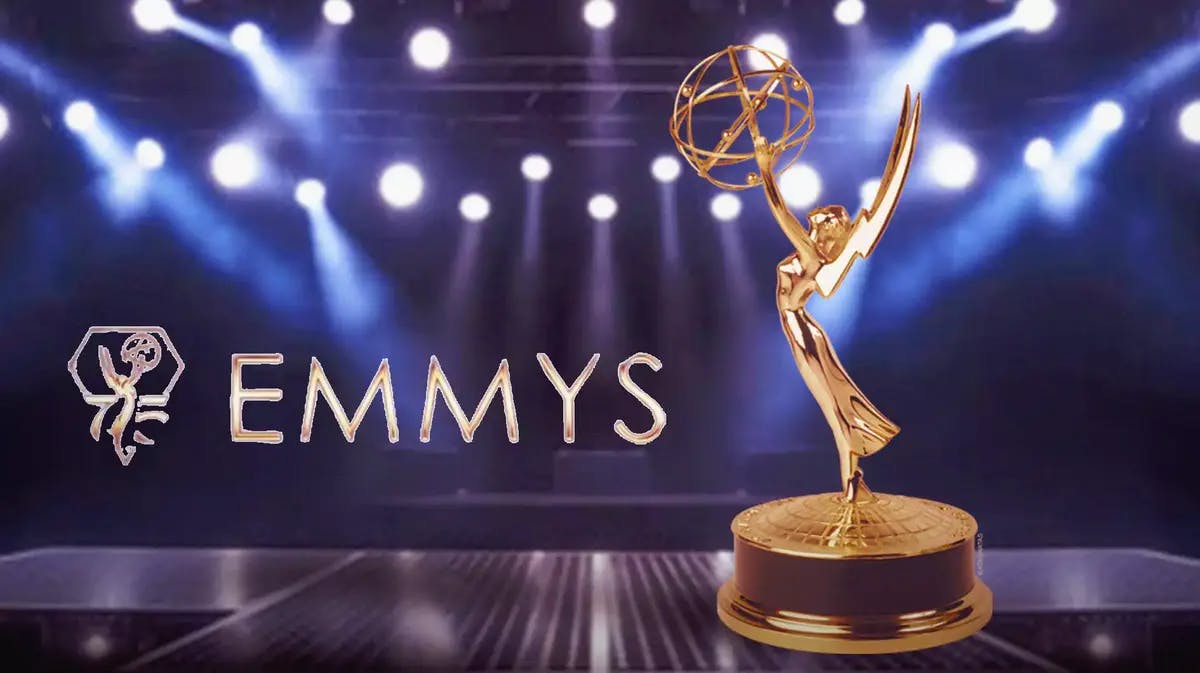 Emmy logo and trophy on stage with lights