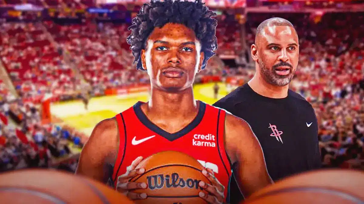 Amen thompson front and center, appearing optimistic with rockets Coach Ime Udoka towering behind him, with Rockets arena background