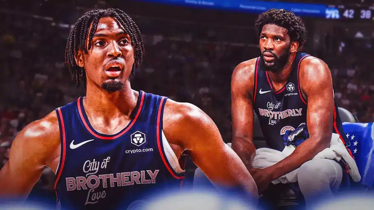 76ers' Tyrese Maxey next to Joel Embiid sitting on the bench