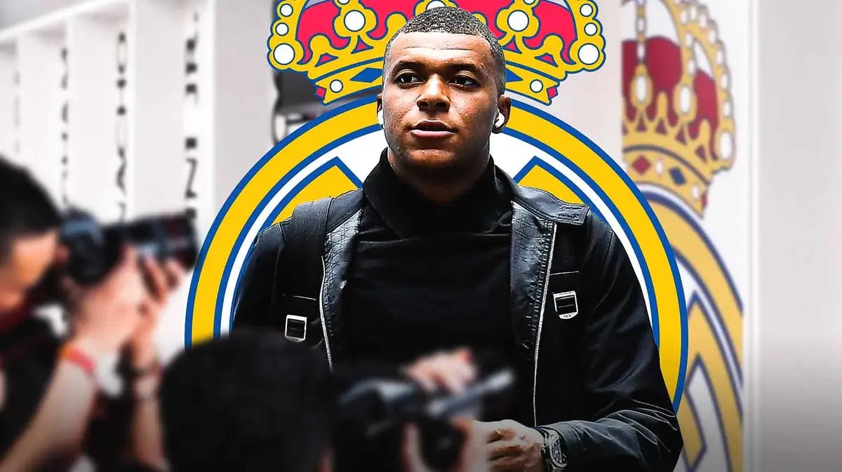 Kylian Mbappe in the dressing room, the Real madrid logo behind him